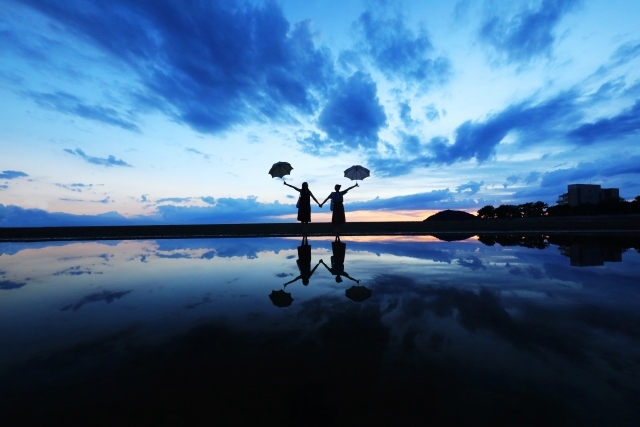 Father and mother are beach and water surface